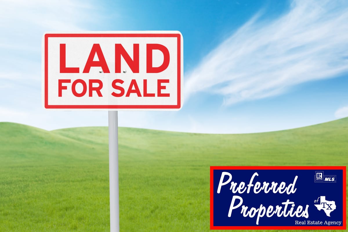A sign with bold red letters reading 'LAND FOR SALE' is prominently displayed in the foreground. The sign is set against a backdrop of a lush green field under a blue sky with scattered clouds. In the bottom right corner, there is a blue and red logo for 'Preferred Properties of Tx Real Estate Agency', featuring a map outline of Texas and real estate branding.