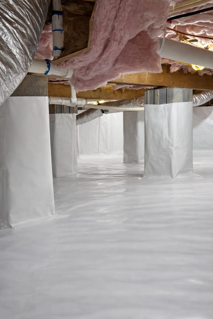Sealed Crawl Space with White Vapor Barrier and Pink Insulation Under Exposed Wooden Beams and Ductwork