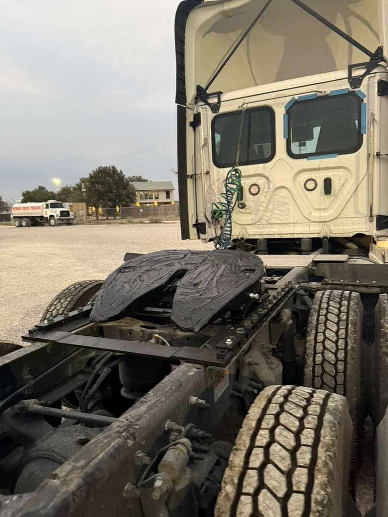Semi-Truck Cab with Open Hood in Parking Lot