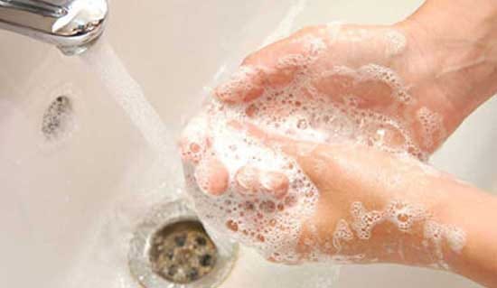Thorough Handwashing with Soap Under Running Water in a Sink with Suds and Bubbles Thorough Handwashing with Soap Under Running Water in a Sink with Suds and Bubbles