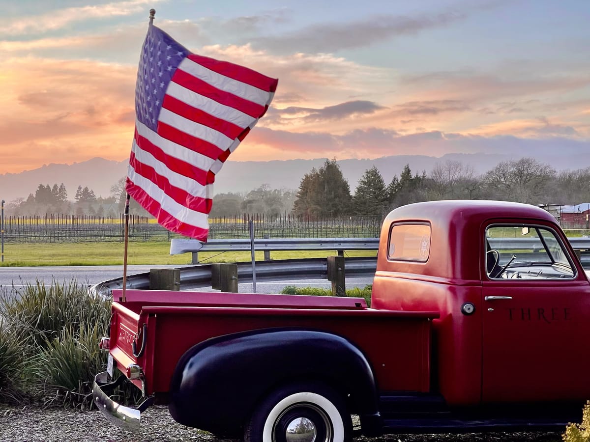 Three Fat Guys Winery Vintage Truck with American Flag at Sunset