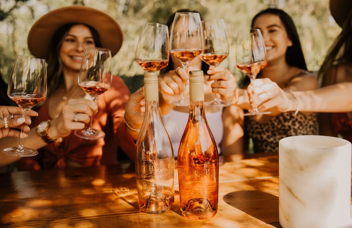 Friends Toasting with Rosé Wine Outdoors