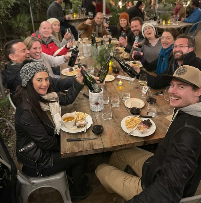 Group Enjoying a Festive Outdoor Dinner Party