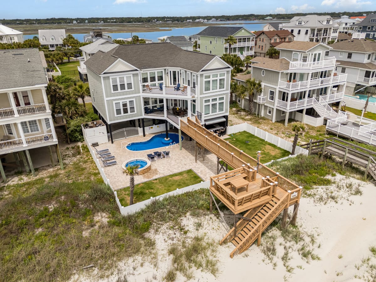 Luxurious Beachfront Home with Elevated Deck, Pool, and Scenic Ocean View in Coastal Residential Area